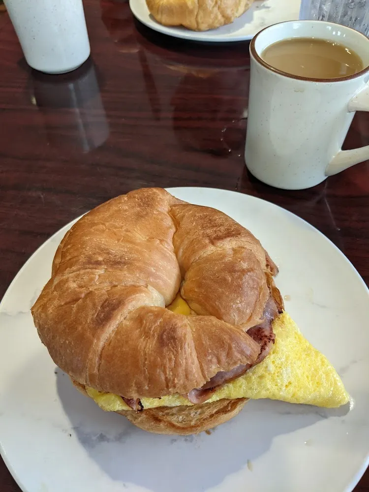 Breakfast Sandwich Egg Ham and Cheese on Croissant